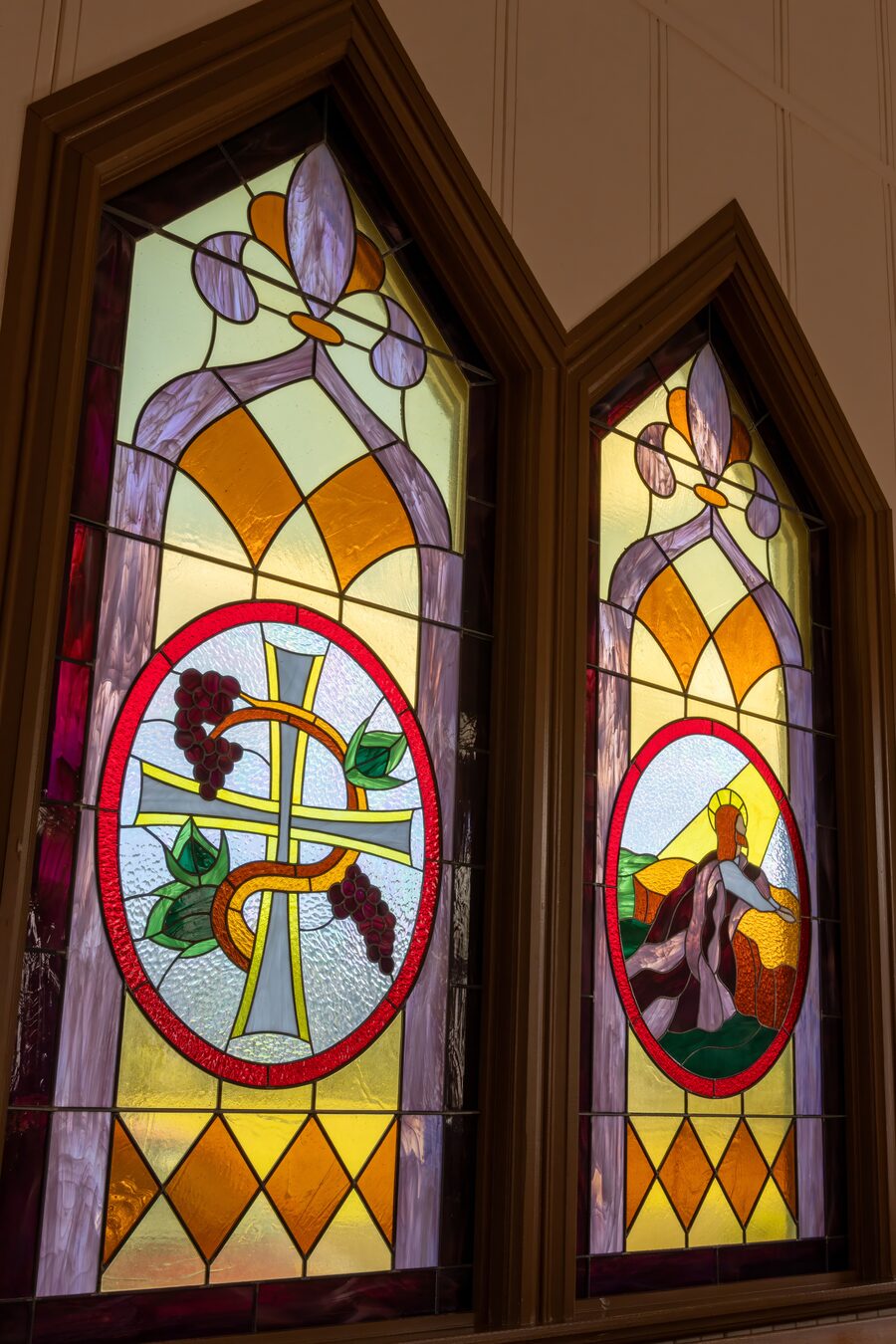 Portrait of Christ above a wooden cross